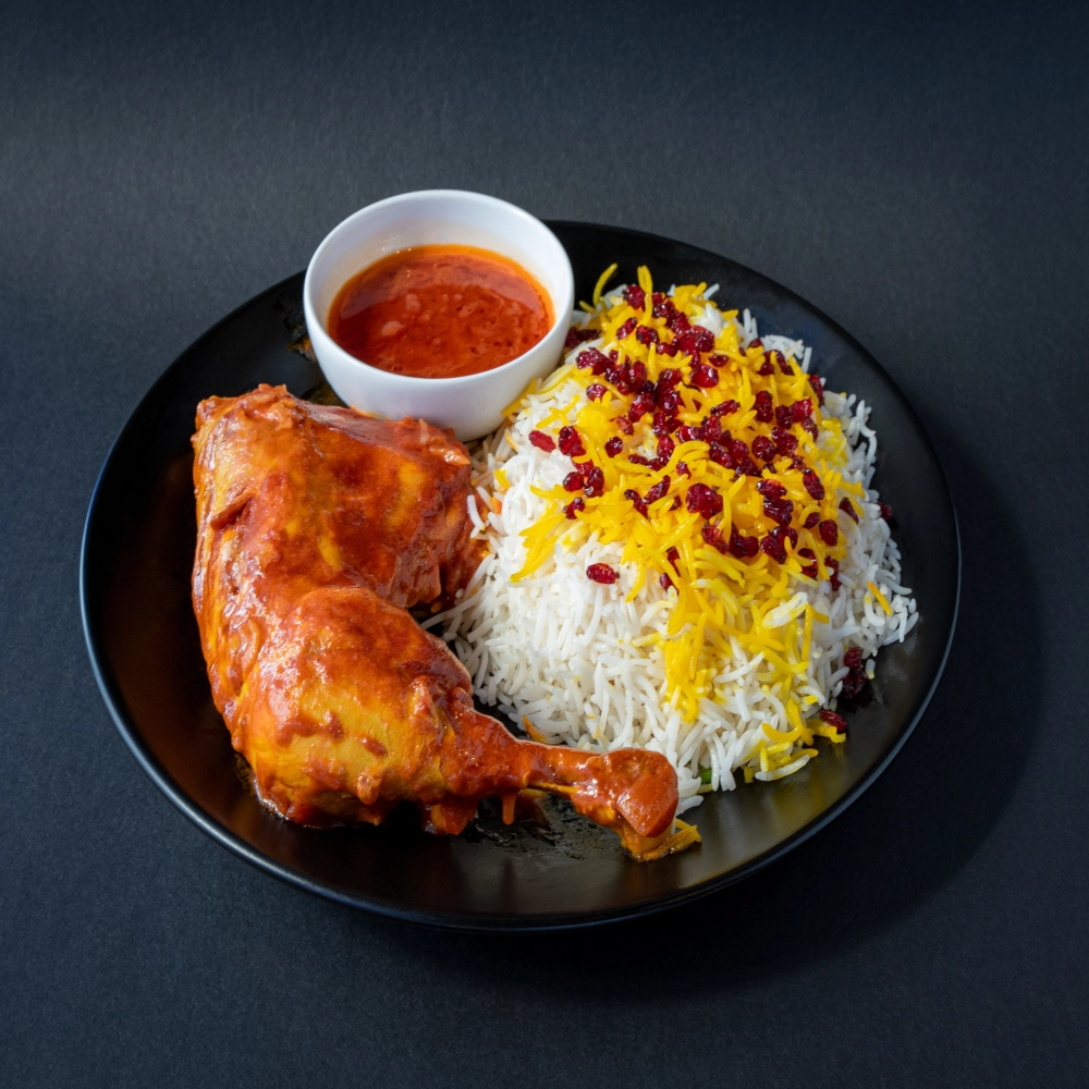 Zereshk Polo ba Morgh, a Persian classic that has flavors of saffron, barberry tartness, and tender chicken woven into every bite.
